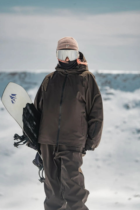 Person in Baggy Fit Ski Jacket For Men And Women Insulated Waterproof Windproof Snow Coat Loose Snowboarding Jacket For All Day Comfort