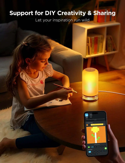 Lit RGBIC Smart Table Lamp 2 with touch control and 64 scene modes on a desk, child drawing, room in soft lighting, phone app visible