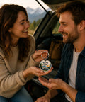 Couple holding Camper Keychain for RV Lovers and Road Trip Fans in a scenic outdoor setting