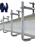 Beefy 4 Pack Heavy Duty 12 Inch F Clamp Set With 4 3/4 Inch Throat Depth, shown clamping a metal beam, with gloves