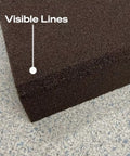 Close-up of the surface texture of an Imperfect Dual Angle And Dual Grit Sanding Block, highlighting medium grit detail and size.