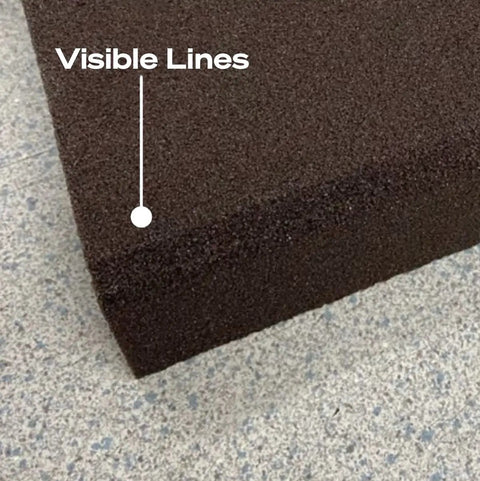 Close-up of the surface texture of an Imperfect Dual Angle And Dual Grit Sanding Block, highlighting medium grit detail and size.
