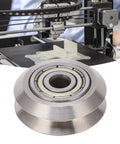 Top Shelf 13 Piece V Groove Guide Pulley Kit Featuring Heavy Duty Stainless Steel Bearings for 3D Printers with a close-up view of a pulley.