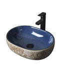 Hella Sleek Round Porcelain Bathroom Vessel Sink With Chrome Pop Up Drain Above Counter Vanity Art Basin High Gloss Scratch Resistant Ceramic Built Tough And Looking Sharp For Your Daily Setup, oval shape with floral design.