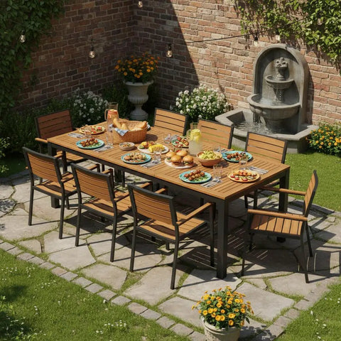 Acacia Wood Outdoor Dining Table For Eight With Umbrella Hole Metal Legs And Adjustable Foot Pads 79 Inch Rectangular Patio Table set for dining with chairs on a stone patio in a garden setting.