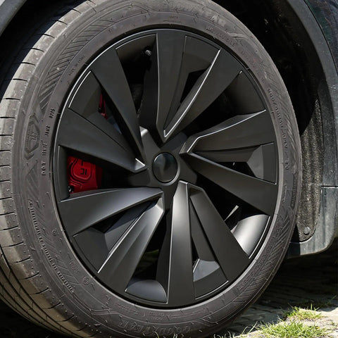 Premium Matte Black 19 Inch Spiral Aero Wheel Covers Sweet Fit For Tesla Model Y Juniper close-up on tire and wheel design.