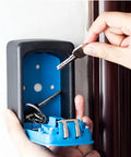 Solid Aluminum 4 Digit Combo Lock Storage Box For Home Or Office, Anti-Theft Wall Mounted Key Machine Safe being used to store keys.