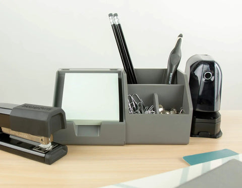 Desktop organizer with stapler, pencils, office staple remover with magnetic pick up, ergonomic push style, and hole punch.