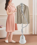 Effortless Standing Garment Steamer With Ironing Board, Adjustable Height, 1.4L Water Tank, High Steam Output, White in use