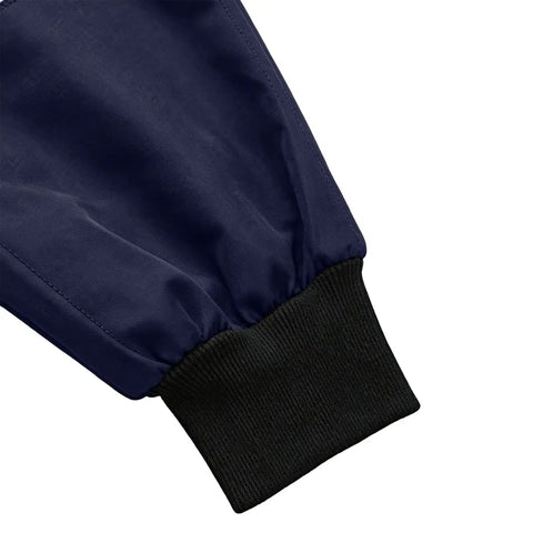 Close-up of the cuff of Mens Heavy Duty Mechanic Lab Coat With Reflective Safety Strips Breathable Navy Workshop Uniform.