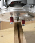 Universal 7 Inch Router Base Plate With Adjustable Swivel Wings And Clear Top For Sharp Vision showing precision bit over wood.