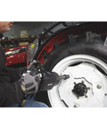 Person using Heavy-Duty Air Impact Wrench With 8 Inch Anvil And D-Handle on a vehicle wheel in a shop
