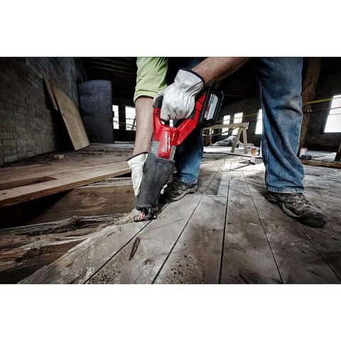 Worker using M18 FUEL Super Sawzall Cordless Reciprocating Saw With Powerstate Brushless Motor And Redlink Plus for demolition