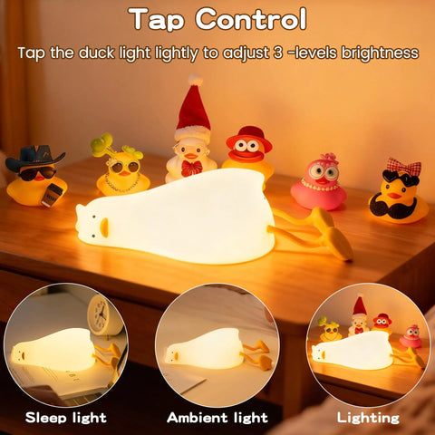 Squishy Silicone Rubber Duck Night Light For Nursery Baby And Kids Dimmable Rechargeable Touch Led Lamp BPA Free Non Toxic Bedside Light For Breastfeeding glowing on desk with toy ducks