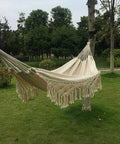 Handmade Cotton Woven Hammock Chair With Rope Swing And Crochet Fringe For Indoor Outdoor Patio Backyard Garden Boho Vibes Natural White Built For Cozy Relaxation And Easy Indoor Or Outdoor Living hanging between trees