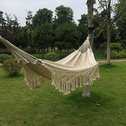 Handmade Cotton Woven Hammock Chair With Rope Swing And Crochet Fringe For Indoor Outdoor Patio Backyard Garden Boho Vibes Natural White Built For Cozy Relaxation And Easy Indoor Or Outdoor Living hanging between trees