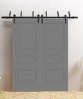 Grey painted sliding barn bypass closet doors 84 by 96 inches with 8ft rails in modern bedroom setting