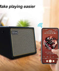 Portable 30 Watt Acoustic Guitar Amp With Bluetooth Speaker, Rechargeable Battery, shown with smartphone streaming music.