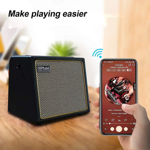 Portable 30 Watt Acoustic Guitar Amp With Bluetooth Speaker, Rechargeable Battery, shown with smartphone streaming music.