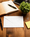 Bulk 250 White Paper Envelopes 6.26 By 4.25 Inches For Checks Cash Invoices Postcards And Mailing Supplies on a wooden desk