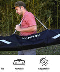 Person carrying Portable Hammock Stand 15 Lb Lightweight With Quick Setup And Chair Mode Carry Bag And Straps Hang Anywhere