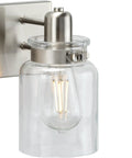 Calhoun Collection Clear Glass Farmhouse Bath Vanity Light Three Light Brushed Nickel Vintage Inspired Fixture close-up view