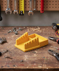 Wire Soldering Holder With Heat Resistant Silicone Stand And Five V Shaped Grooves Plus Storage Tray, yellow, on workbench.