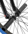 Close-up of 24 Inch Kids Freestyle BMX Bike For Beginners For Boys And Girls Aged 7 To 12, durable Hi Ten steel frame, blue tire