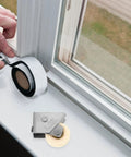 Top Shelf Stainless Steel Sliding Door Roller Featuring Adjustable Window Track Wheel For Dead Simple Installation And Dang Tough Performance On House Projects with tape and roller in use.