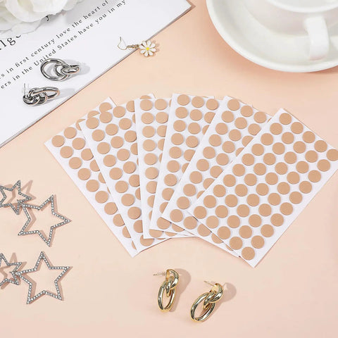 Secure Fit Ear Piercing Covers for Sports and Heavy Earrings 400 pcs skin tone EVA discs on sheets, shown with earrings