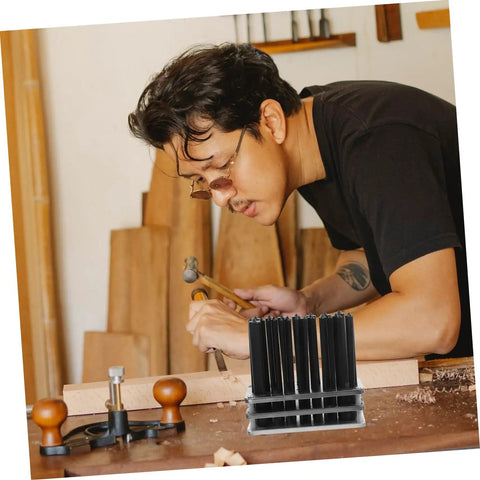 Craftsman using essential cylindrical punch set for woodworking and metalworking, pro grade hole making and repair tool kit.