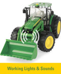 Front view of 1/16 Scale Big Farm 6210R Tractor With Loader And Spreader Toy Set showing working lights and loader
