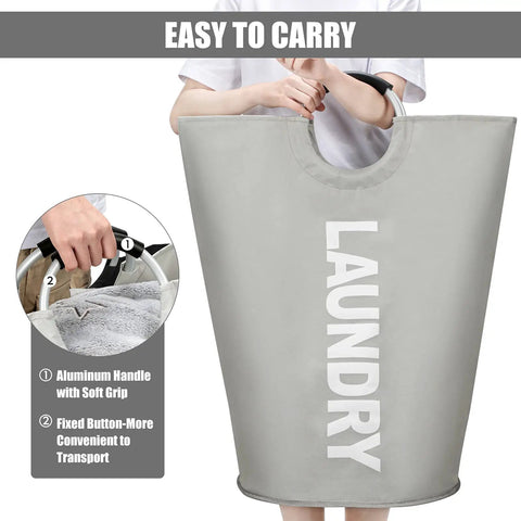 Person carrying 115L XXL Collapsible Laundry Hamper With Aluminum Soft Grip Handle, Freestanding Tall Laundry Bin, Foldable Grey Washing Basket