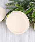 4pcs Rubber Sink Stopper White with Hanging Ring for Laundry Bathtubs, showing rubber stoppers on a wooden surface.
