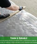 Person measuring Ultra Clear 6 Mil Plastic Sheeting For Indoor And Outdoor Use 12x25 Durable Drop Cloth Or Patio Cover Weatherproof Vapor Barrier