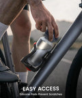 Cyclist using Bike Water Bottle Holder With Hidden Tracker Storage For Handlebar And Frame, Adjustable Cup Cage for easy access.