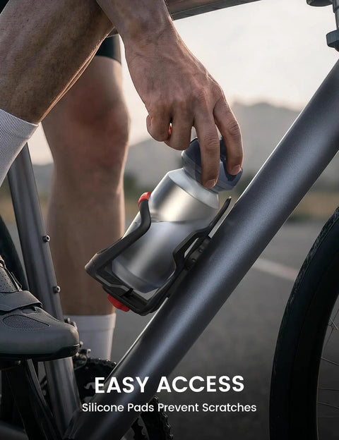 Cyclist using Bike Water Bottle Holder With Hidden Tracker Storage For Handlebar And Frame, Adjustable Cup Cage for easy access.