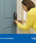 Woman installing Smart WiFi Deadbolt With Keyless Keypad And Bluetooth Access In App Monitoring Auto Lock Weatherproof IP54 DL100
