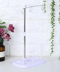 Top Tier 15 Bobbin Thread Stand For Sewing Machines, Rock Solid Embroidery Spool Holder With Slick Thread Flow, Effortless Operation Home Sewing Organizer, Purple in a modern home setting.