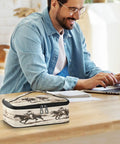 Smiling man with a Desert Cowboys Insulated Lunch Bag With Leakproof No Spill Design on a desk next to him.