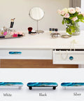 Four Pack Aqua Aquamarine Blue Water Cabinet Handles installed on white vanity drawer with serene ocean wave design and jewel tone finish