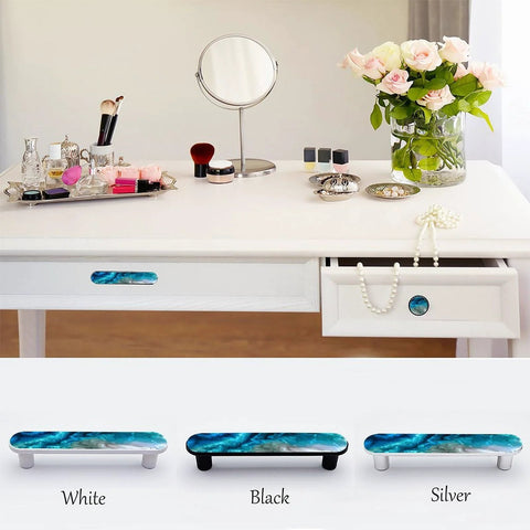 Four Pack Aqua Aquamarine Blue Water Cabinet Handles installed on white vanity drawer with serene ocean wave design and jewel tone finish