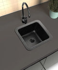 Overhead view of Glasgow 12-Inch Dual Mount Bar Prep Sink Hand Hammered Matte Black Aluminum Drop-In Or Undermount Kitchen Sink in dark countertop.