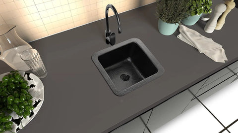 Overhead view of Glasgow 12-Inch Dual Mount Bar Prep Sink Hand Hammered Matte Black Aluminum Drop-In Or Undermount Kitchen Sink in dark countertop.