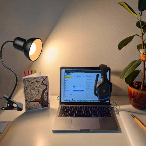 Gooseneck Clip On Desk Lamp With 360 Degree Rotation Easy Clip On Reading Light illuminating a laptop on a desk