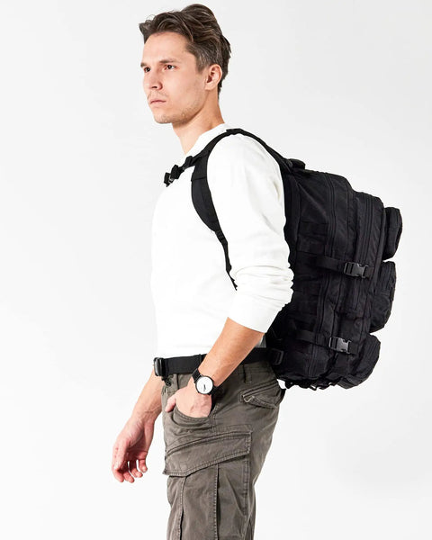 Man wearing Rugged 50L Tactical Backpack For Men And Women With Two Point Four Times Stronger Fabric Water Resistant Military Molle Rucksack