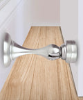 Heavy Duty Magnetic Door Stopper Finished In Sleek Satin Nickel To Lock Doors Wide Open and prevent wall scuffs, close-up view.