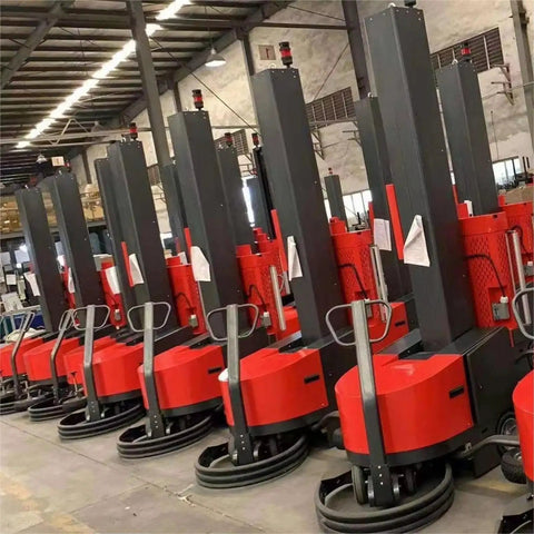 Row of red automatic pallet wrapping machines for warehouse and logistics, heavy duty stretch wrap system for secure load handling