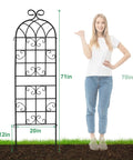 2 Pack Metal Garden Trellis For Climbing Plants, 6 Ft Tall By 20 In Wide, Rustproof Black Coating next to person for scale