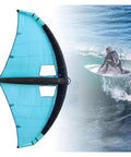 Side view of Ride-Ready Inflatable Wing Foil For Wind Wing Foiling And Kitesurfing, blue handheld sail with surfer on water